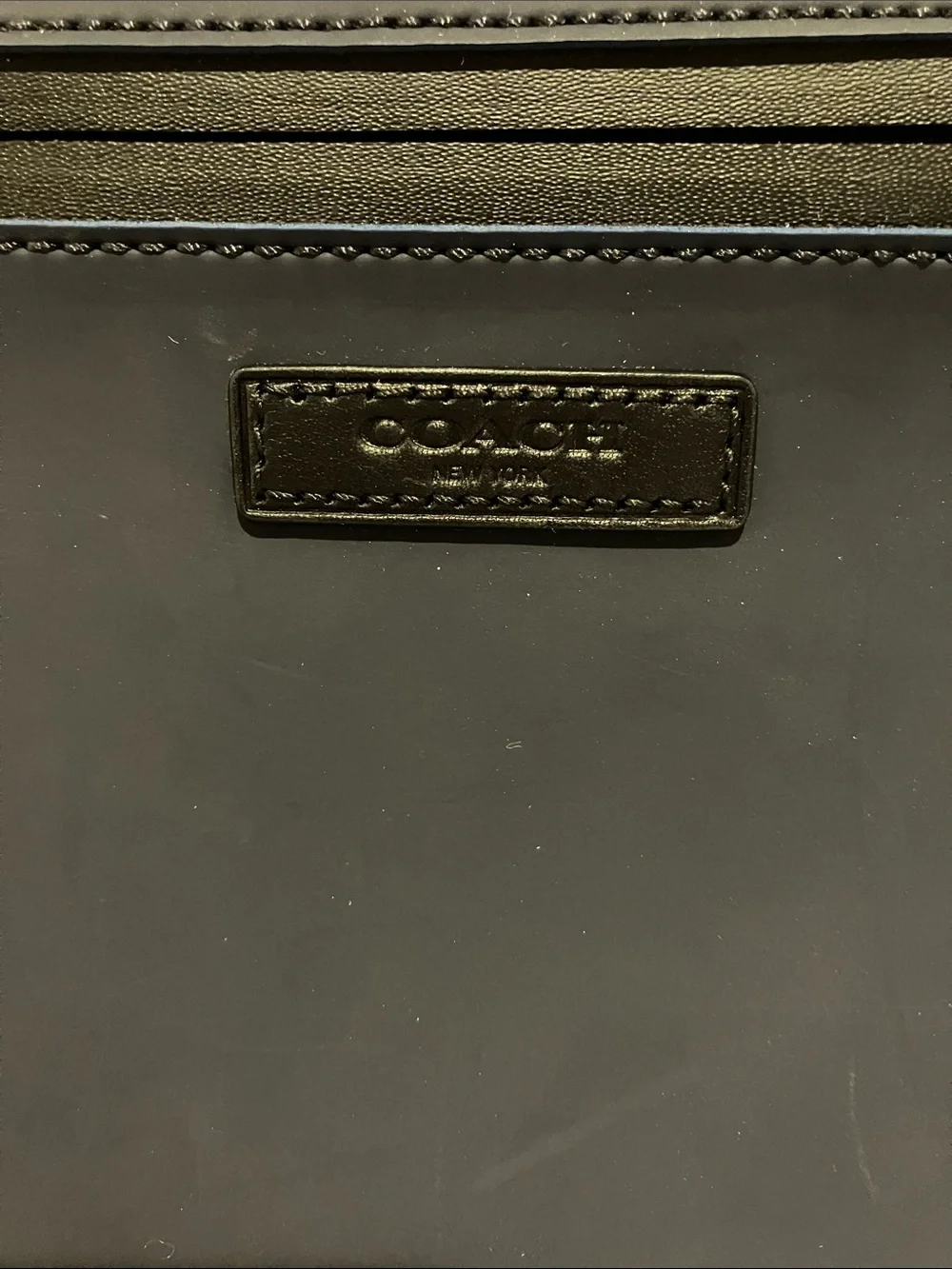 Coach Navy Cervo Leather Laptop Sleeve with Front Zip, water resistant.